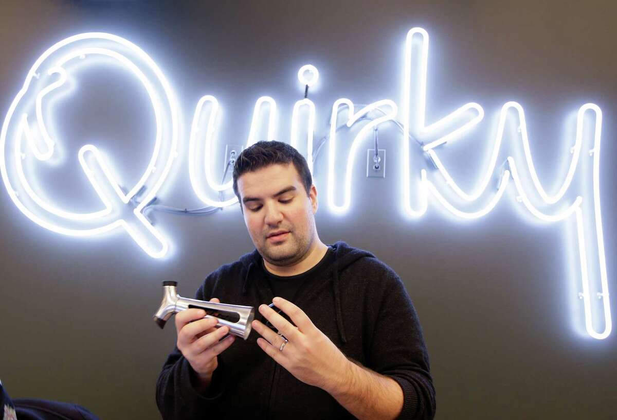 In this Thursday, Nov. 21, 2013 photo, Quirky CEO Ben Kaufman looks a a wine and bottle opener his company markets, in New York. Kaufman created an employee "blackout week" once each quarter in which no one besides the company's customer service representatives area allowed to work. The startup company shepherds inventions to the marketplace. (AP Photo/Kathy Willens)