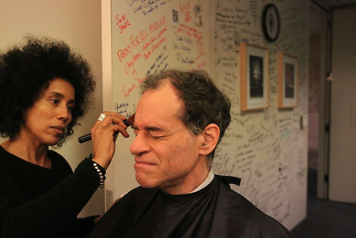 Ron Unz gets hair and makeup from freelance makeup artist Kadidja Sallak in the green room before participating in a live televised discussion about minimum wage with host Thuy Vu and guest Ken Jacobs, Chair with the Center for Labor Research and Education for the Institute for Research on Labor and Employment December 6, 2013 at the KQED building in San Francisco, Calif.