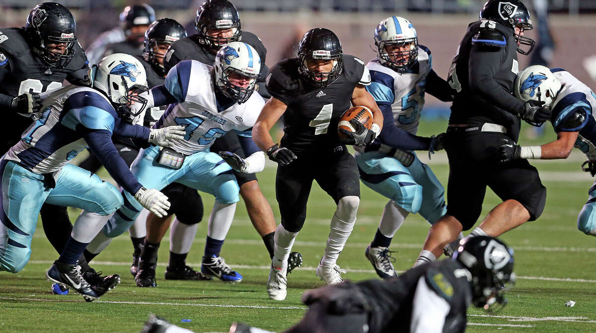 Justin Stockton rolls for the Knights in the fourth quarter as Johnson beats Steele 42-41 at Bobcat Stadium in the 5A quarterfinals on December 7, 2013.