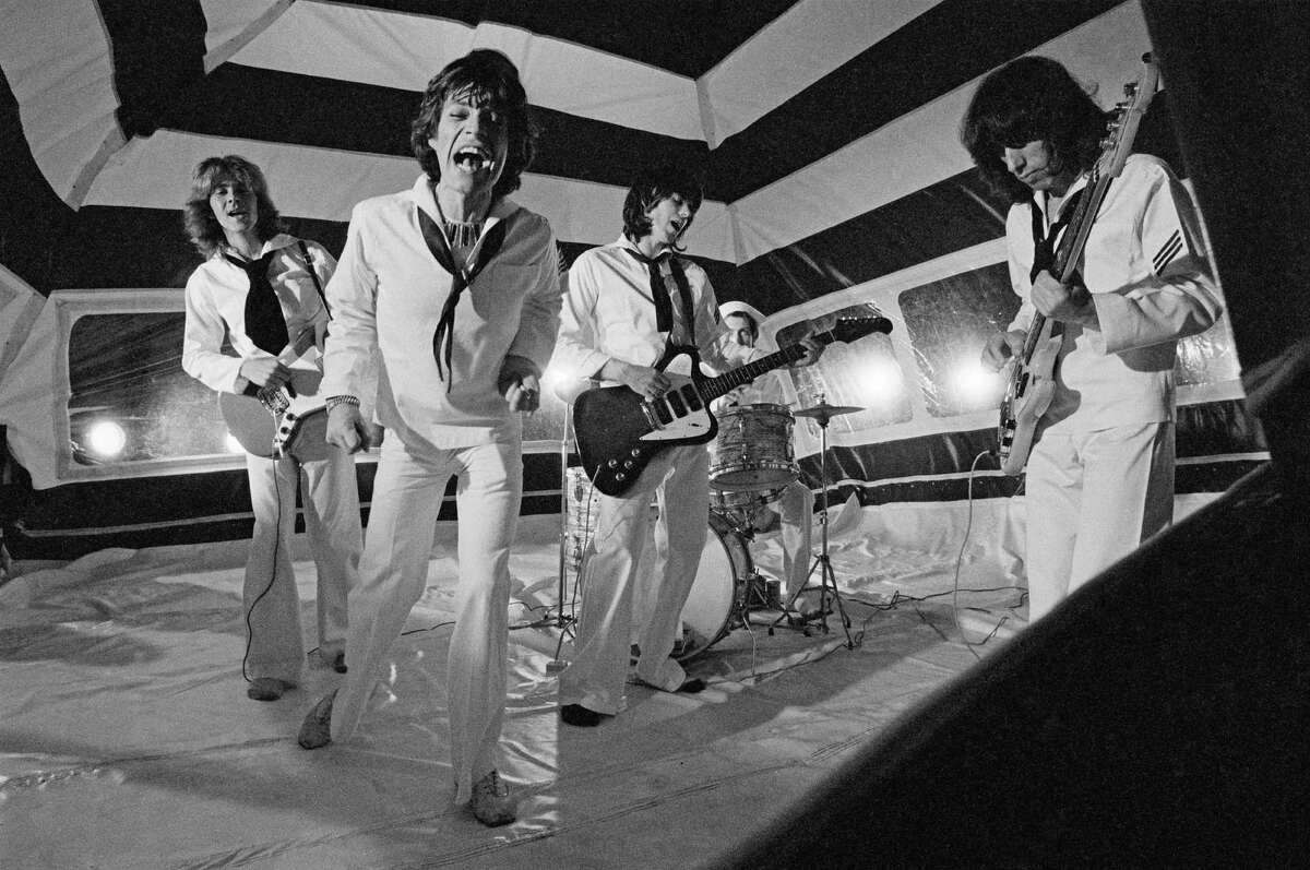 The Rolling Stones — Mick Taylor (from left), Mick Jagger, Keith Richards, Charlie Watts and Bill Wyman — pose during the production of their music video for "It's Only Rock 'n Roll (But I Like It)" in June 1974 in London.