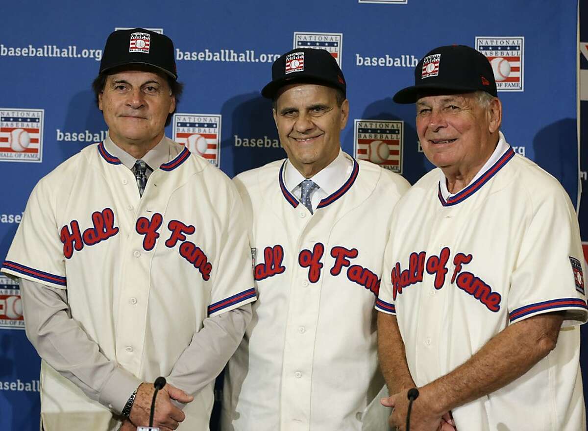 Retired managers, from left, Tony La Russa, Joe Torre and Bobby Cox gather for a photo after it was announced that they were unanimously elected to the baseball Hall of Fame, at a news conference during MLB winter meetings in Lake Buena Vista, Fla., Monday, Dec. 9, 2013. (AP Photo/John Raoux)