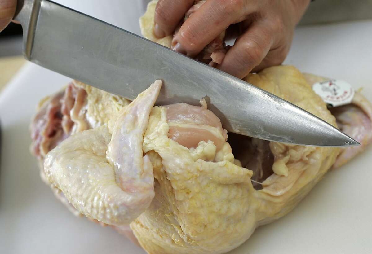 step-by-step how to cut up a whole chicken Photo by Penni Gladstone/The San Francisco Chronicle Photo taken on 1/16/06, in San Francisco, CA. Ran on: 01-18-2006 Chef Paul Canales demonstrates his techniques for making a poultry sugo at Oliveto in Oakland.