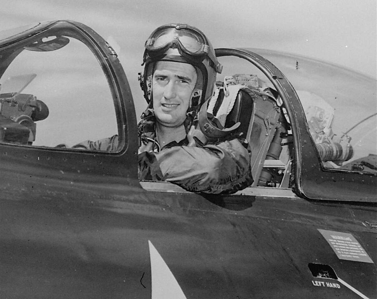 Ted Williams, former Boston Red Sox slugger, is shown in cockpit of a Marine F9F-5 Panther jet fighter plane while taking a refresher course in Sept. 1952. Williams, a Marine captain, crash-landed his burning Panther jet fighter bomber, February 16, 1953 at a forward base in Korea. He was participating in a 200 plane strike in North Korea. Williams walked away from his damaged plane and there was no indication he suffered any injuries. (AP Photo)