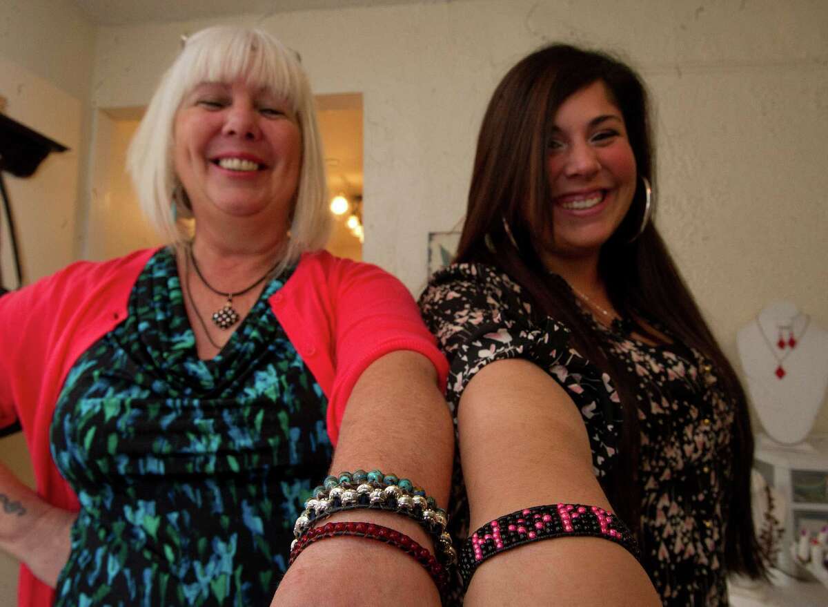 Sandy D'Andrea and her daughter, Stevie, owners of Jewels for Hope, pose for a photo in their Stamford home on Friday, December 6, 2013.