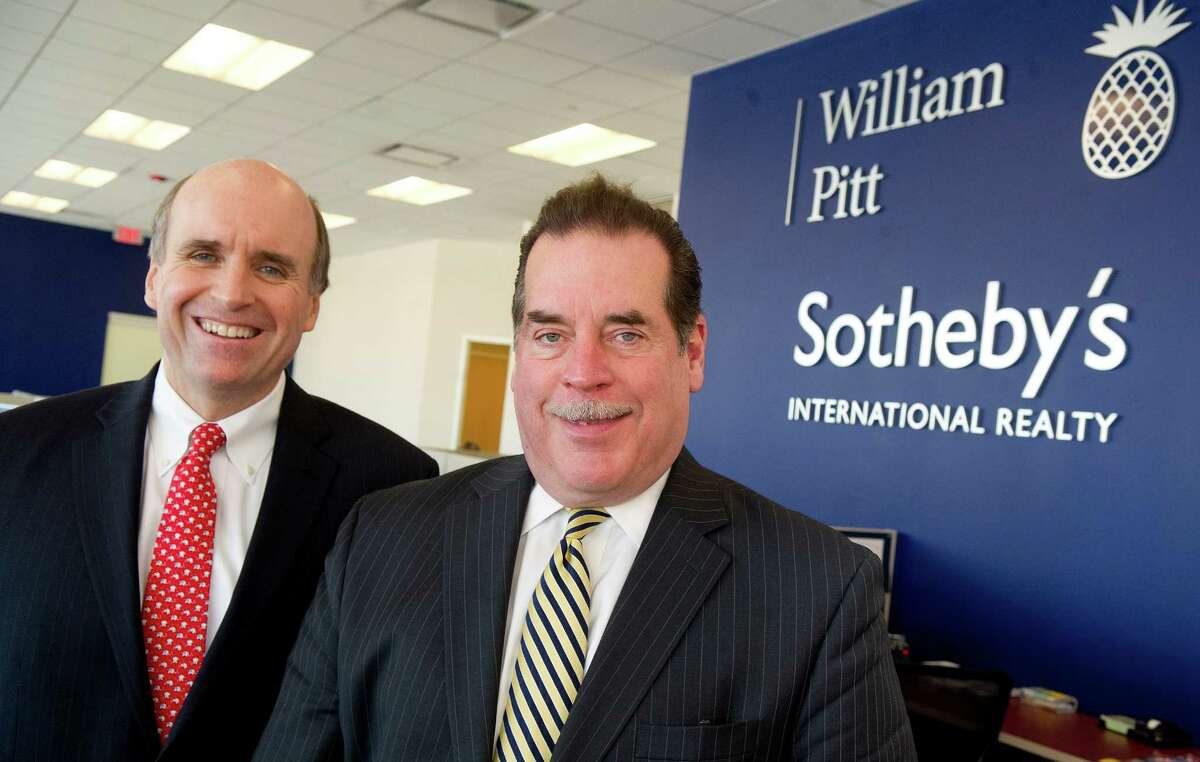 William Pitt Sotheby's CEO Paul Breunich, left, and New Canaan office brokerage manager Bill Larkin, right, pose for a photo in the Stamford office on Wednesday, December 11, 2013.