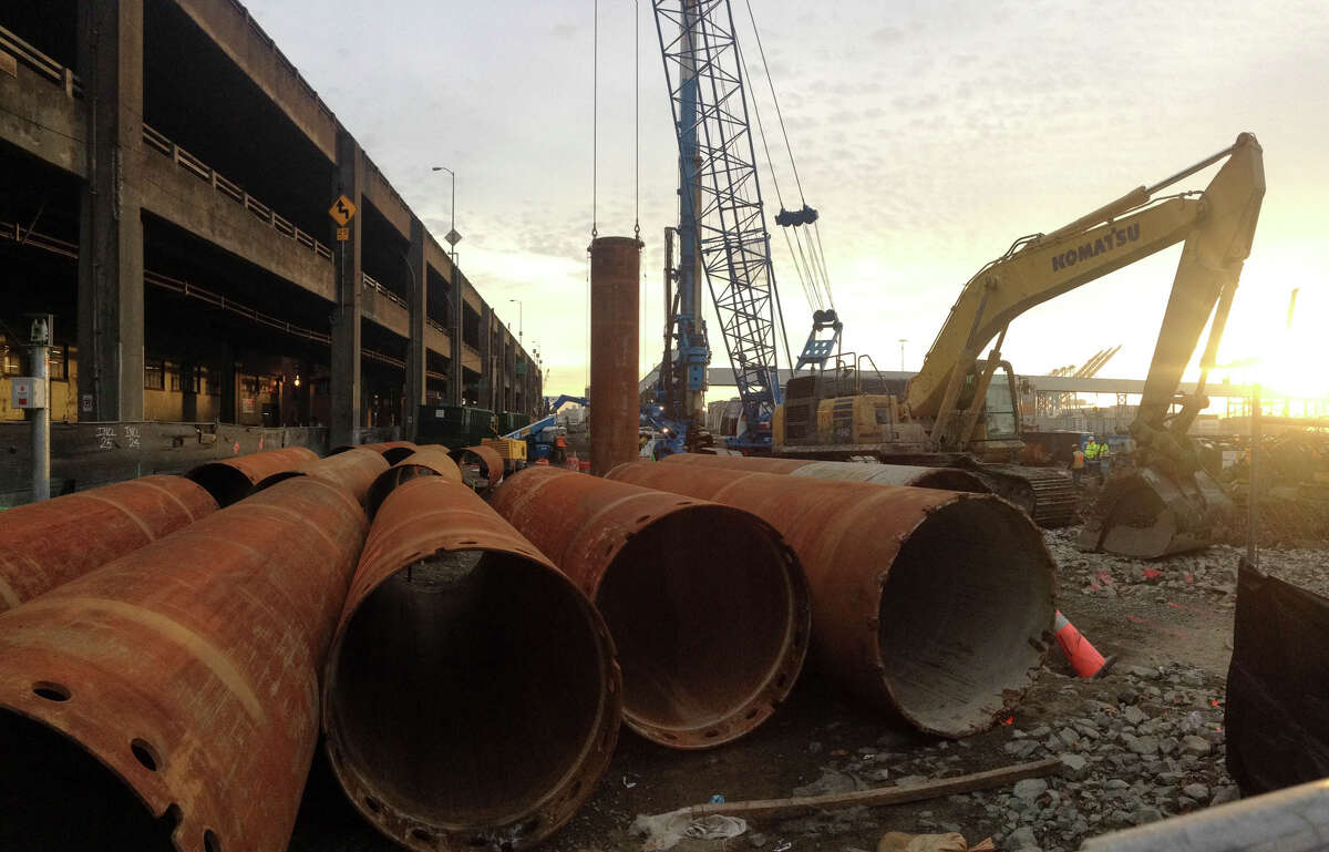 Sections of a drill rig are shown as it begins the process of digging a hole so workers can figure out what blocked Bertha, the tunnel boring machine making its way under the Seattle waterfront. Photographed on Wednesday, December 11, 2013.