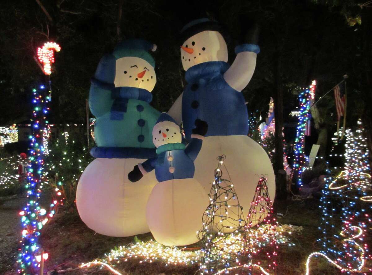 A snowman family is on display at the EmilyAnn Theatre and Gardens in Wimberley.