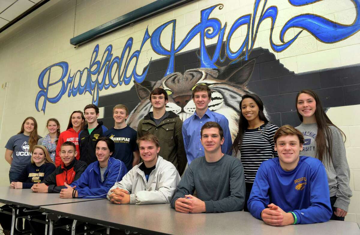 Brookfield High School in Brookfield, Conn, recognized student athletes Thursday, Dec. 12, 2013, who have signed or will be signing National Letters of Intent to play their sports in college. They are from left standing, Samantha Mazur, Carolyn Marron, Anna Brown, Dan Dixon, Tyler Mannion, Liam Clancy, Parker Timmerman, Liah Baity and Brooke Sands. Seated they are from left, Stephanie Hunt, Brad Westmark, Joseph Redd, John Vitti, Daniel Krentsa and Nick Miller, all age 17.