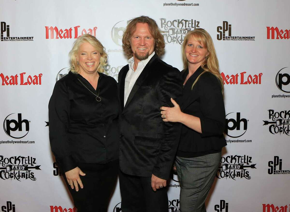 Reality stars from the TV show "Sister Wives" Janelle Brown, Kody Brown and Christine Brown (left to right) arrive at the show "RockTellz & CockTails presents Meat Loaf" at the Planet Hollywood Resort & Casino on Oc. 3, 2013 in Las Vegas, Nevada.