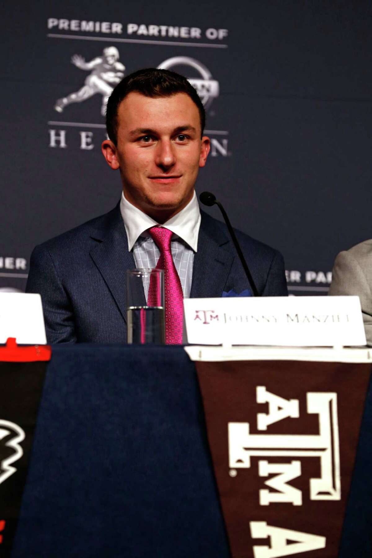 NEW YORK, NY - DECEMBER 14: Heisman Trophy finalist Johnny Manziel, quarterback of the Texas A&M Aggies, speaks to the media during a press conference prior to the 2013 Heisman Trophy Presentation at the Marriott Marquis on December 14, 2013 in New York City. (Photo by Jeff Zelevansky/Getty Images)