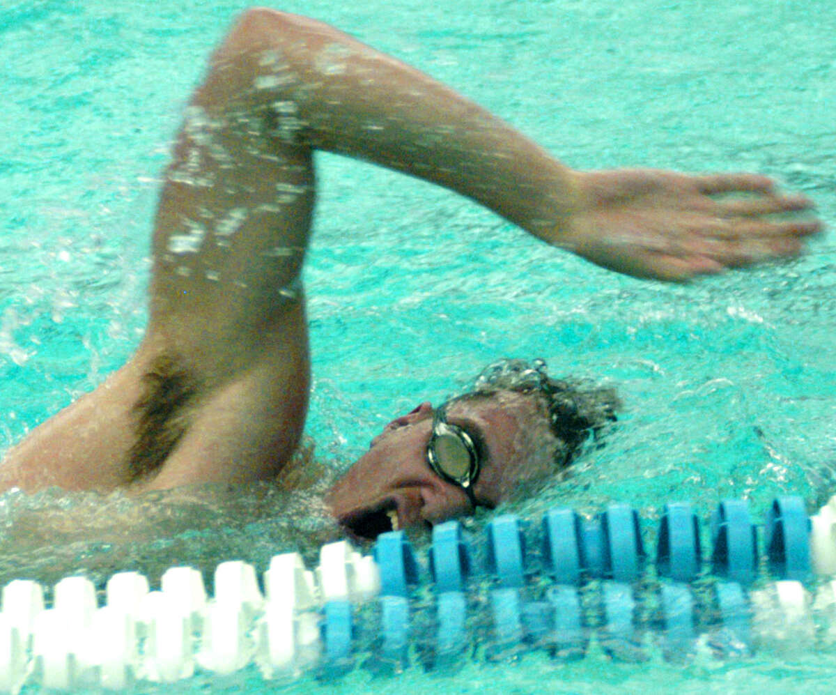 The Green Wave's Wade Elsesser churns out the laps during New Milford High School boys' swim practice at Canterbury School, Dec. 11, 2013