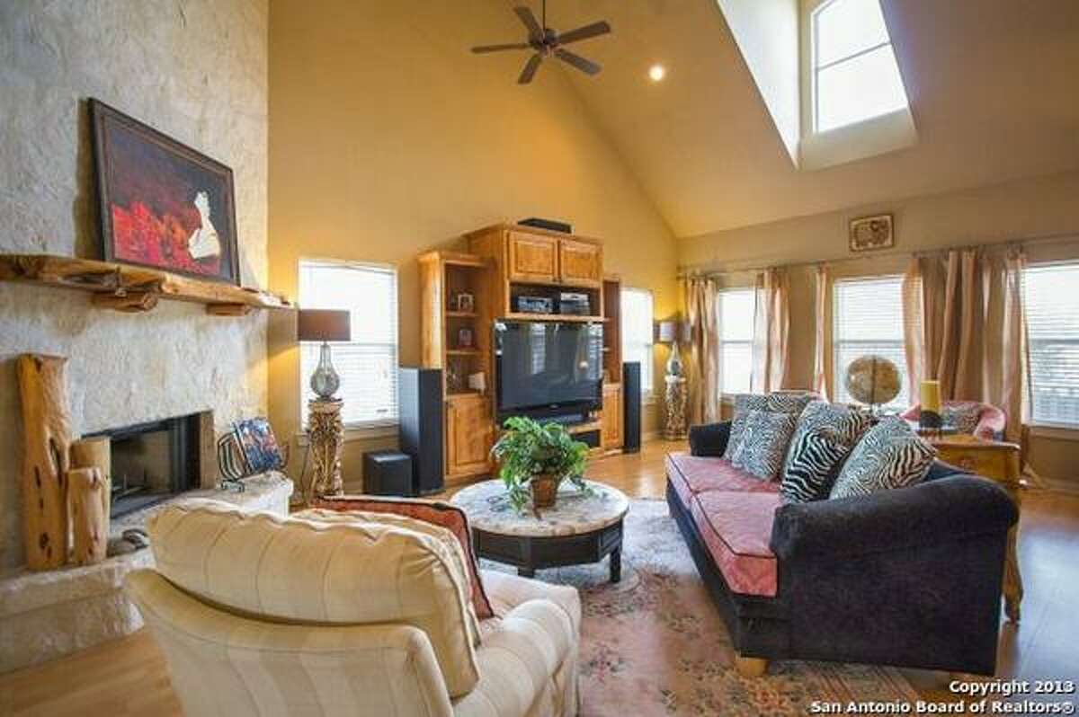 Bright and open floor plan with Pergo flooring, great room with a floor-to-ceiling stone fireplace, gourmet kitchen with granite counter tops, and a downstairs master suite with a spa-like bath. MLS: 1033459