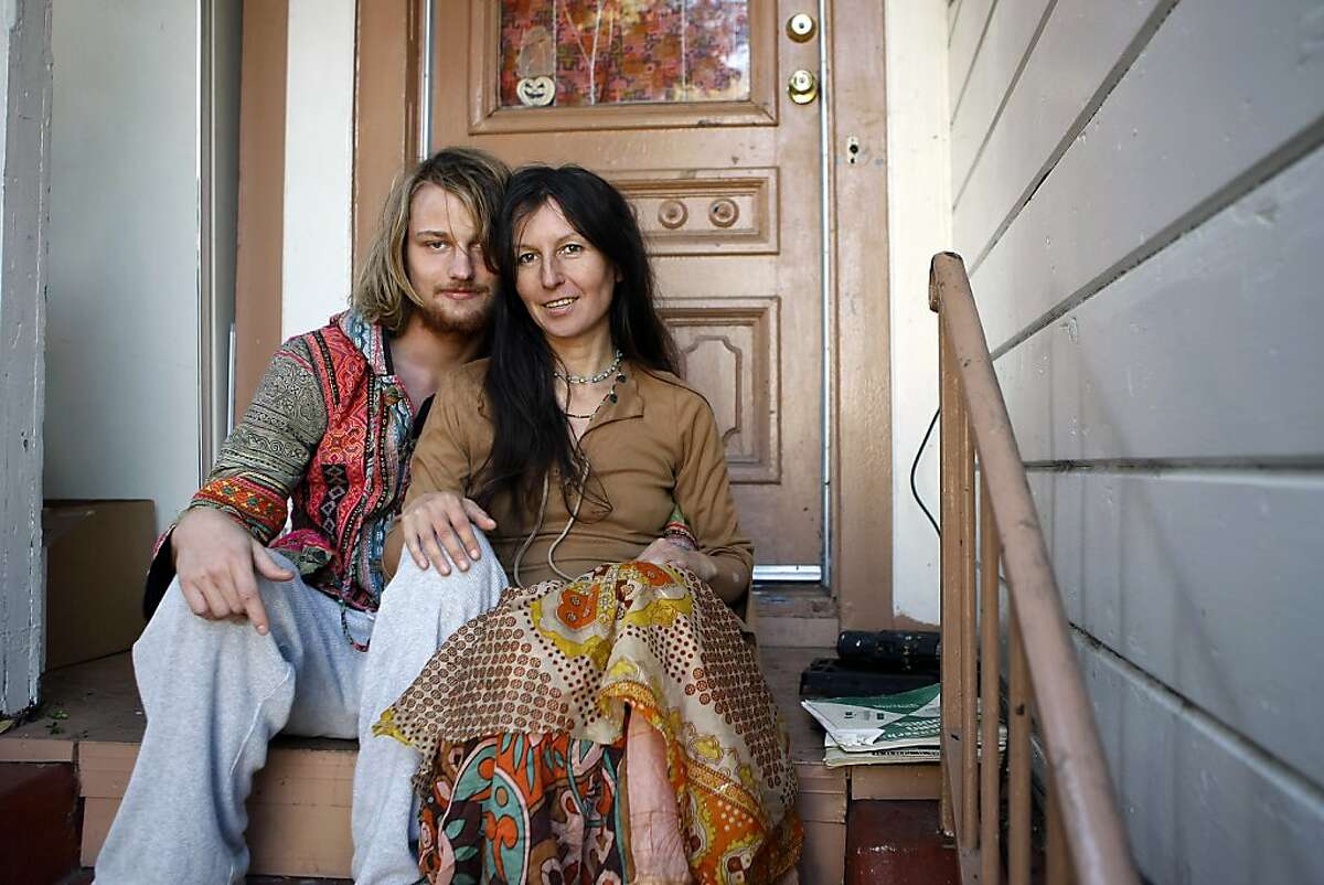 Gypse Taub, right, and her fiance Jaymz Smith sit for a portrait on the front steps of their home in Berkeley, CA, Friday, December 13, 2013. Nudity activists Gypsy Taub and her fiance Jaymz Smith are planning a naked wedding on the steps of San Francisco City Hall on Dec. 19.
