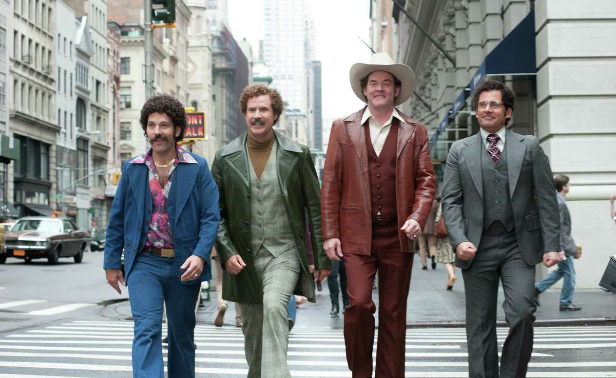 Paul Rudd (from left), Will Ferrell, David Koechner and Steve Carell leave no gag unturned in “Anchorman 2: The Legend Continues.”
