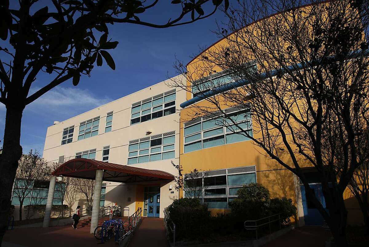 A woman walks into Argonne Elementary School December 17, 2013 in San Francisco.