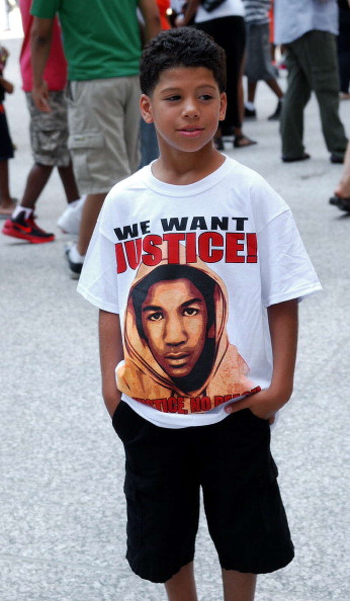 Trayvon Martin (pictured on shirt) ranks in at number 9 US trending people.