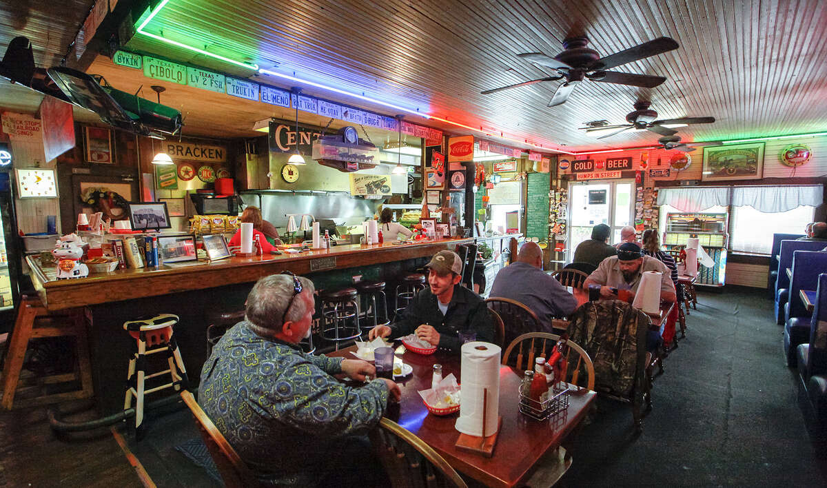 The Bracken Store Cafe's main dining room is awash in the hues of neon red, green and blue on a busy mid-December afternoon.