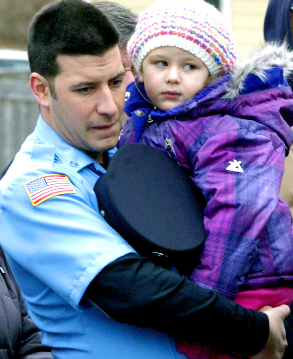 LIfe member Jared Bonner of the Sherman Volunteer Fire Department and his daughter, Mackenzie, are among the hundreds on hand for Sherman's Dec. 8, 2013 festivities celebrating the official opening of the town's emergency services facilty.