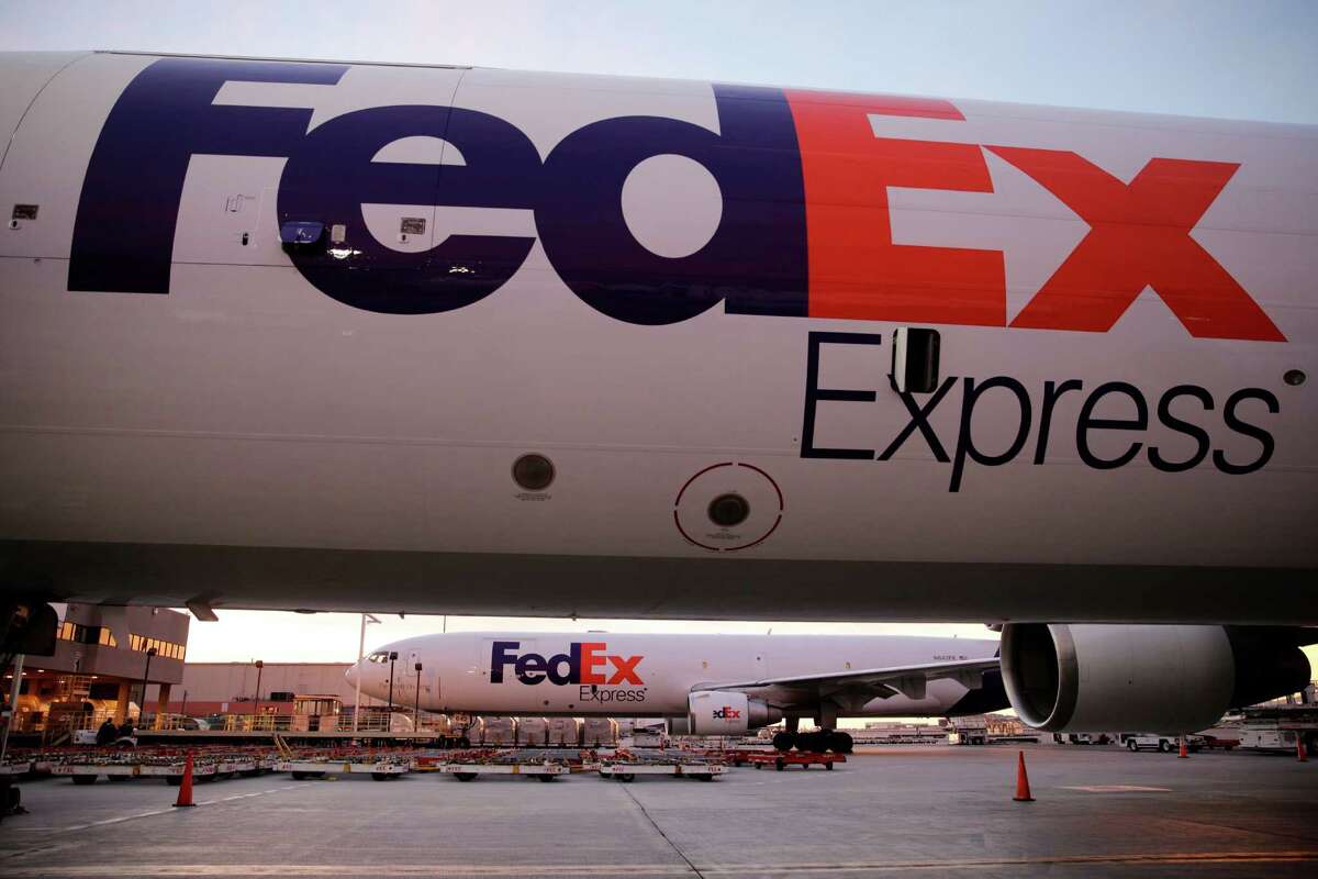 In this file photo FedEx cargo planes sit on the tarmac outside the FedEx hub at Los Angeles International Airport .