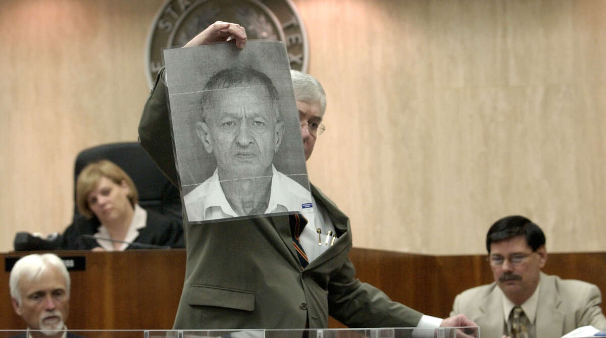 Durst was accused of killing Morris Black. Here, defense attorney Mike Ramsey holds up a photograph of Black for the jury, Sept. 29, 2003, in Galveston.
