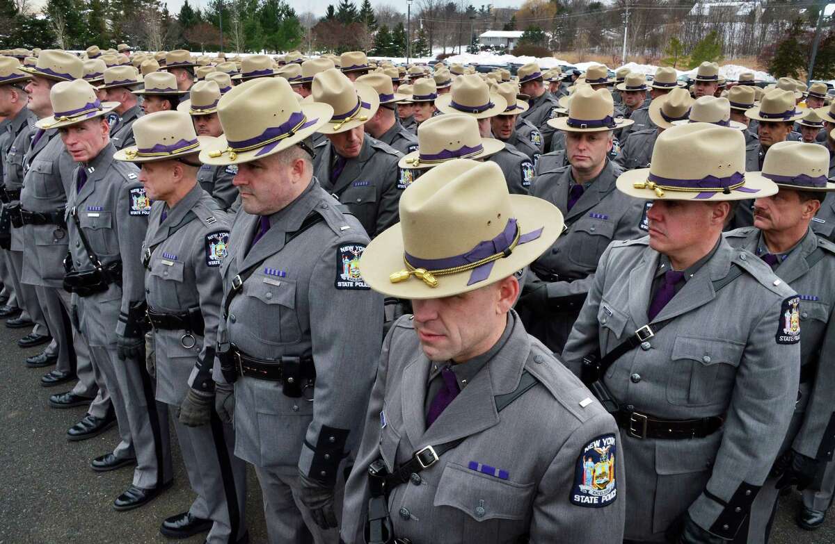 NYS Troopers in formation for David W. Cunniff's funeral at Grace Fellowship Church Friday Dec. 20, 2013, in Colonie, NY. (John Carl D'Annibale / Times Union)