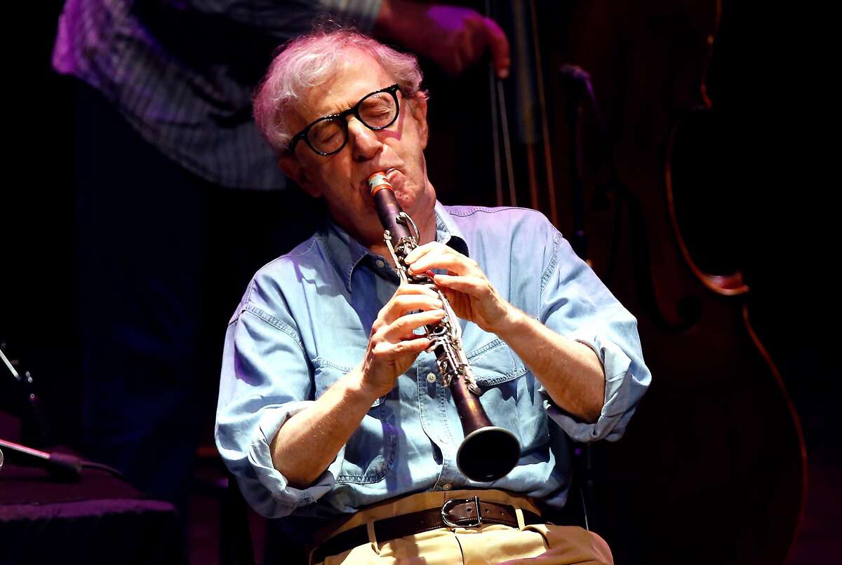 US film director Woody Allen plays clarinet with the New Orleans jazz band on July 21, 2013 in Antibes, southeastern France. AFP PHOTO / VALERY HACHE (Photo credit should read VALERY HACHE/AFP/Getty Images)
