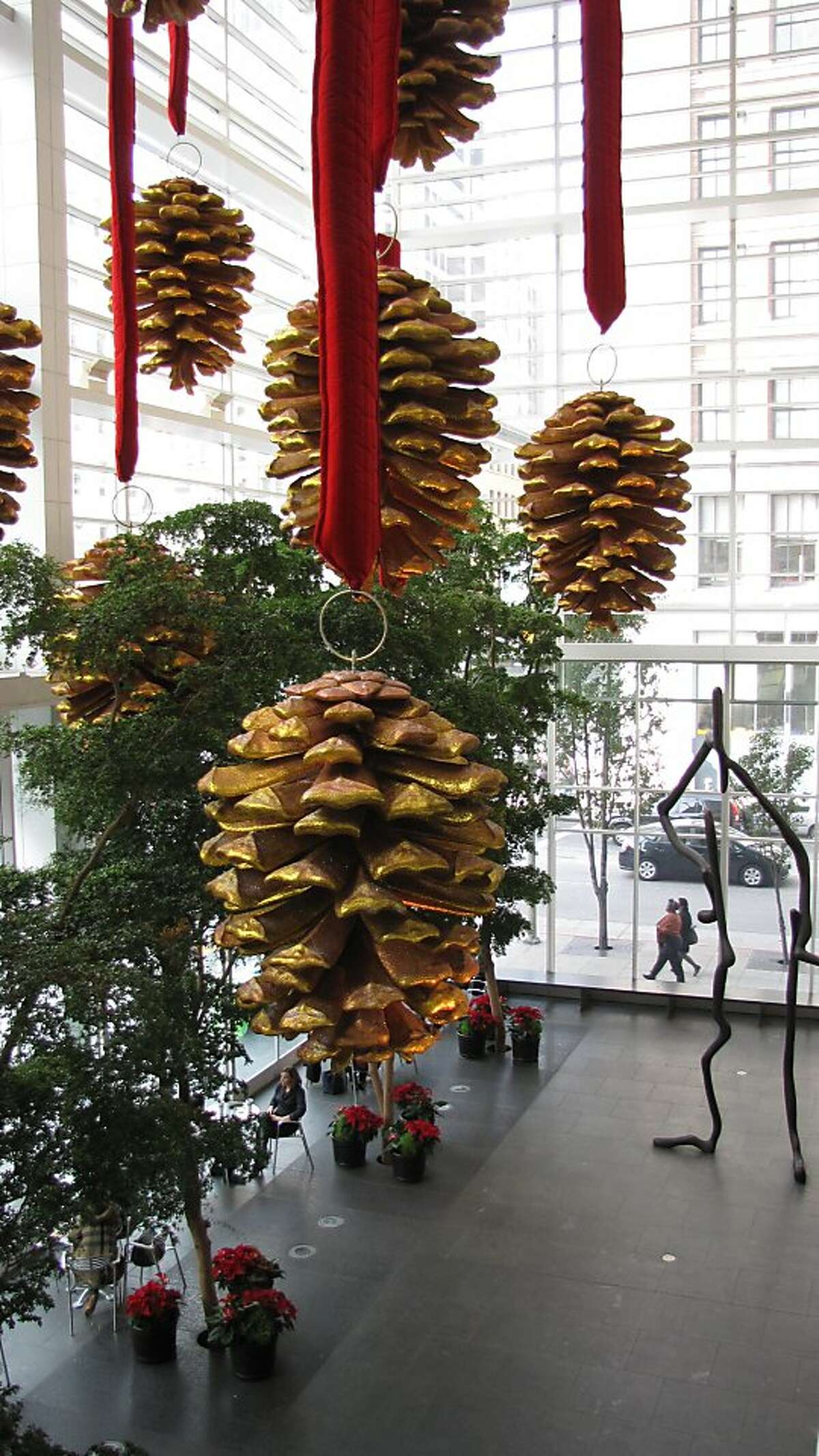 Financial District towers with large holiday decorations include 101 California St. with its tree ornaments, 345 California St. with a huge wreath and 101 2nd St. with huge pine cones hanging in its public "art pavilion."