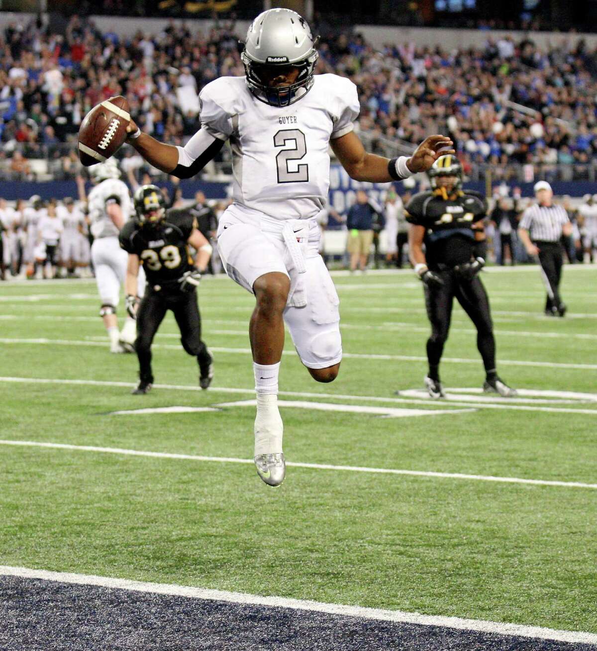 Denton Guyer's Jerrod Heard scores a touchdown against Brennan during first half action of their Class 4A Division I state championship game Friday Dec. 20, 2013 at AT&T Stadium in Arlington, Tx.