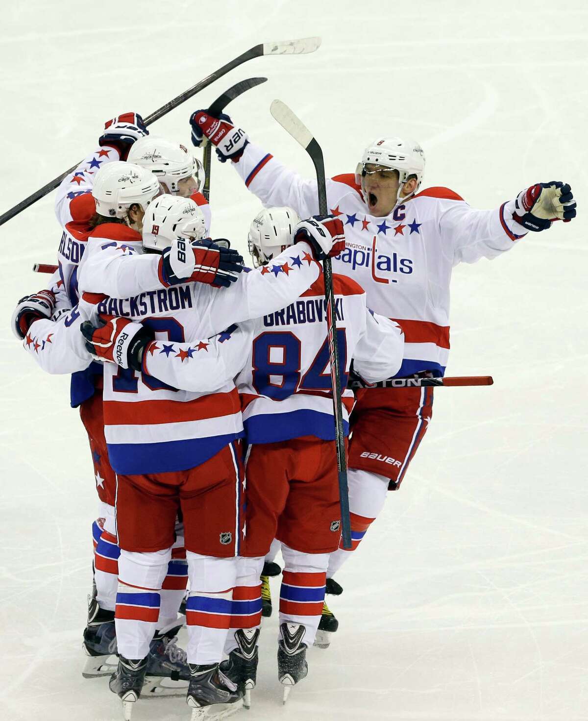 Washington's Alex Ovechkin, right, has a lot to celebrate after he scored his 400th career goal and the Capitals defeated Carolina 4-2 on Friday night.