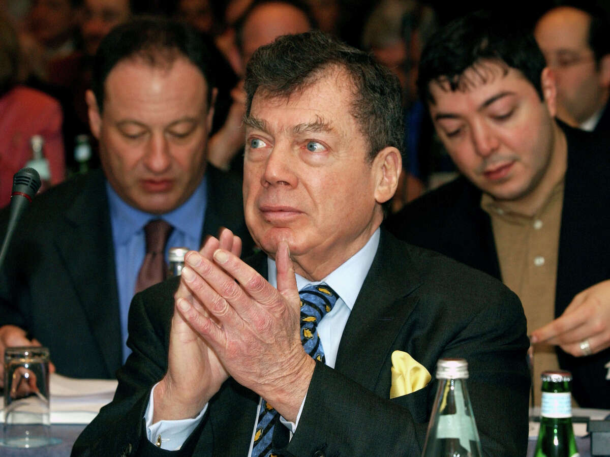 In this Jan. 10, 2005 file photo, World Jewish Congress President Edgar M. Bronfman applauds a speaker while attending the Plenary Assembly of the World Jewish Congress assembled in a hotel in Brussels. 