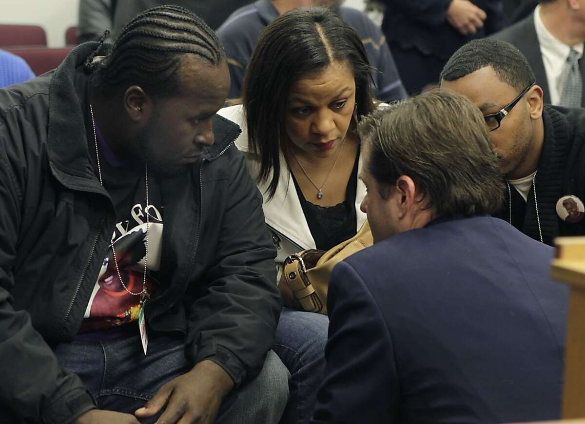 Attorney Christopher Dolan (second from right) confers with Martin Winkfiled, Sandra Chatman and Omari Sealey, family members of Jahi McMath, during a hearing to determine the condition of the 13-year-old in Oakland, Calif. on Tuesday, Dec. 24, 2013. McMath was determined to be clinically brain dead following complications from a routine tonsillectomy at Children's Hospital in Oakland. Dr. Paul Fisher, chief of pediatric neurology at Lucile Packard Children's Hospital, concurred that Jahi meets all the criteria of brain death.