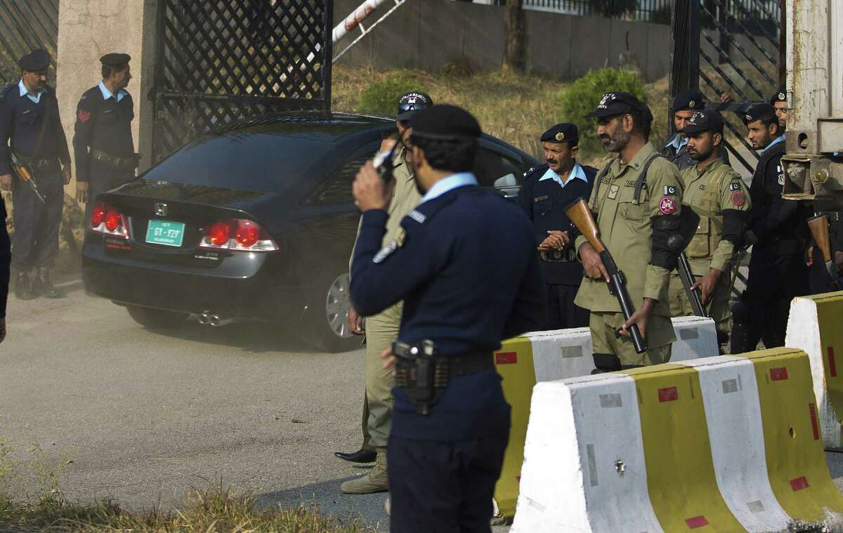 A vehicle carrying Pakistani judge enters in a court building under tight security in Islamabad, Pakistan, Tuesday, Dec. 24, 2013. A bomb scare Tuesday delayed the first hearing in a high treason case against former Pakistani leader Pervez Musharraf, said police and legal officials. (AP Photo/B.K. Bangash)