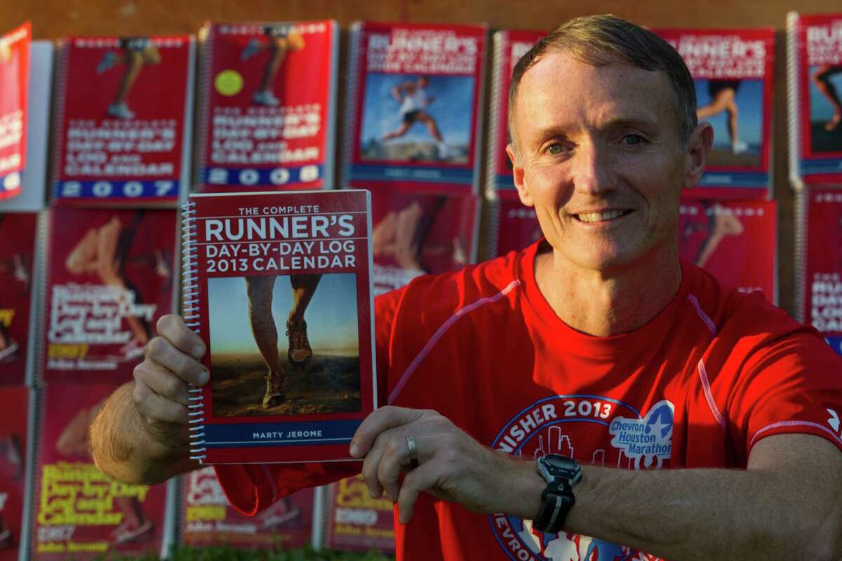 Glenn Heumann has used a new logbook each year to record every one of the more than 50,000 miles he has run since 1983.