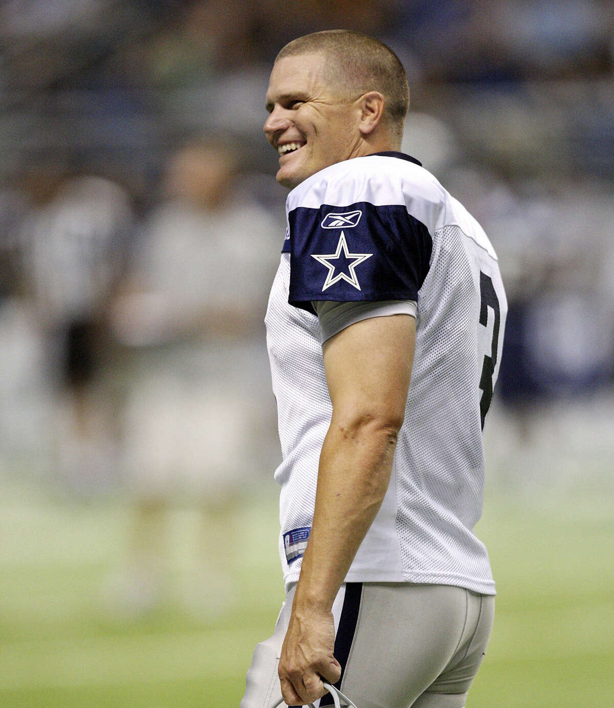 Jon Kitna, shown at Cowboys training camp at the Alamodome in 2011, was coaching high school football before Dallas brought him back at age 41 to serve as a third-string quarterback.