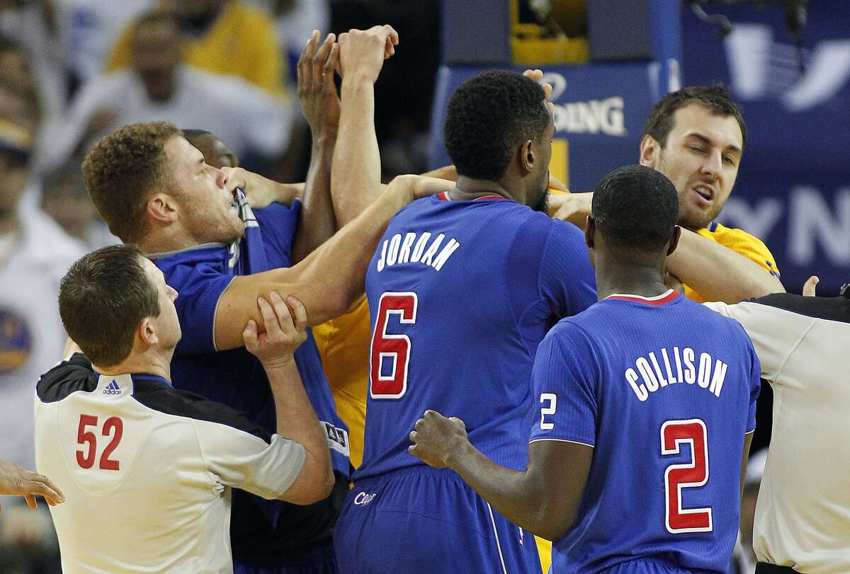 Los Angeles Clippers power forward Blake Griffin, left, fights with Golden State Warriors center Andrew Bogut, right, as Los Angeles Clippers center DeAndre Jordan (6) and Darren Collison (2) look on during the second half of an NBA basketball game, Wednesday, Dec. 25, 2013, in Oakland, Calif. Blake Griffin was ejected from the game. Warriors won 105-103.(AP Photo/Tony Avelar)