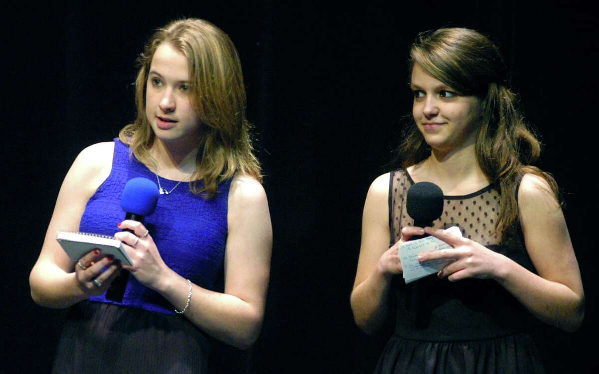 Co-hosts Brianna Walker, left, and Rachel Schaefer welcome the crowd to New Milford High School students' May 19, 2013 performances for the benefit of families of Sandy Hook Elementary School in Newtown.
