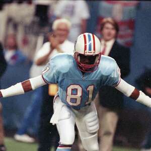 Houston Oilers wide receiver Ernest Givins looks over his shoulder