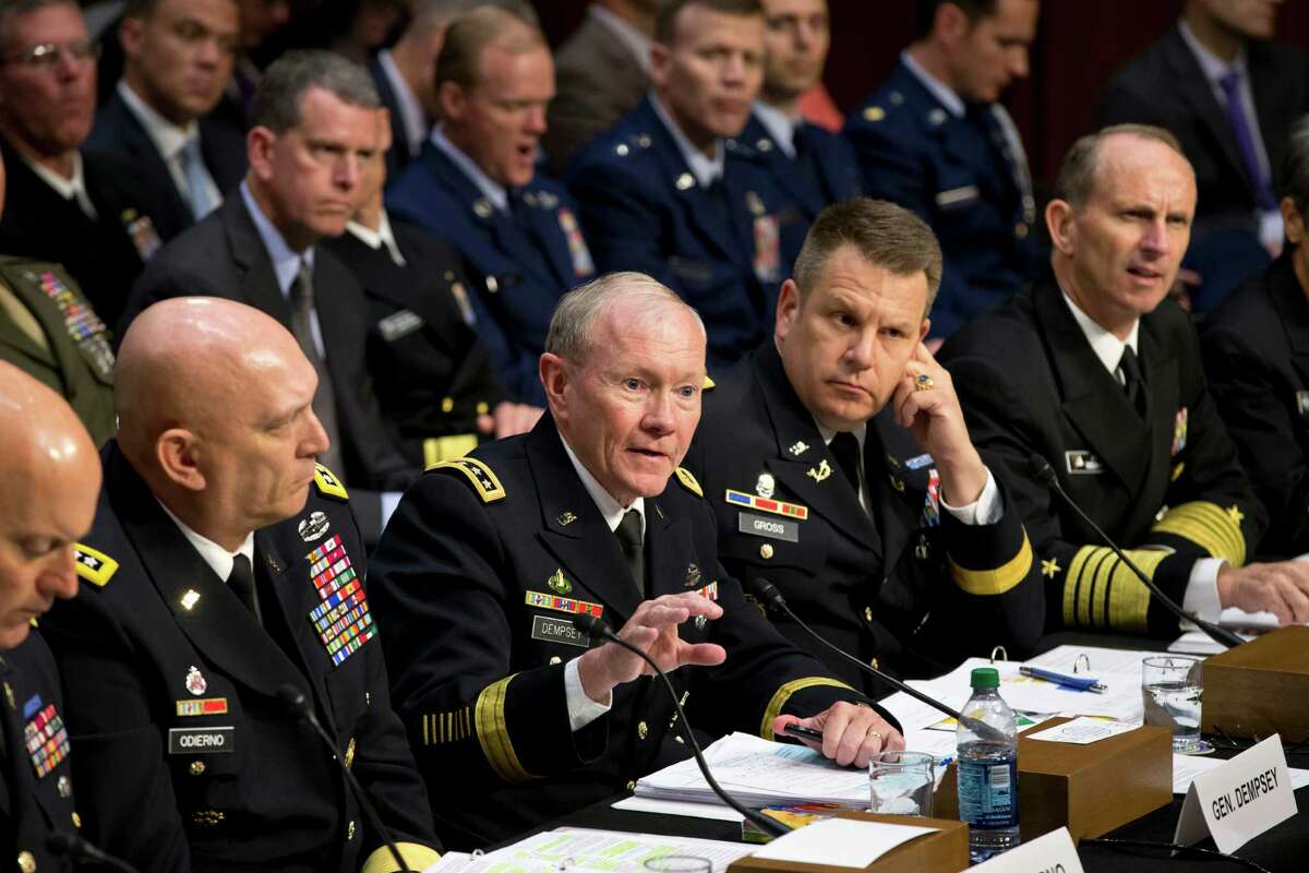 FILE - In this June 4, 2013 file photo, Joint Chiefs Chairman Gen. Martin Dempsey, center, testifies on Capitol Hill in Washington, before the Senate Armed Services Committee hearing investigating the growing epidemic of sexual assaults within the military. The number of reported sexual assaults across the military shot up by more than 50 percent this year. Defense officials suggest that victims are becoming more willing to come forward. The increase follows a tumultuous year of scandals that shined a spotlight on the crimes and put pressure on the military to act aggressively. From left are, Judge Advocate General of the Army Lt. Gen. Dana K. Chipman, Army Chief of Staff Gen. Ray Odierno, Legal Counsel to the Chairman of the Joint Chiefs of Staff Brig. Gen. Richard C. Gross, and Chief of Naval Operations Adm. Jonathan W. Greenert.(AP Photo/J. Scott Applewhite)