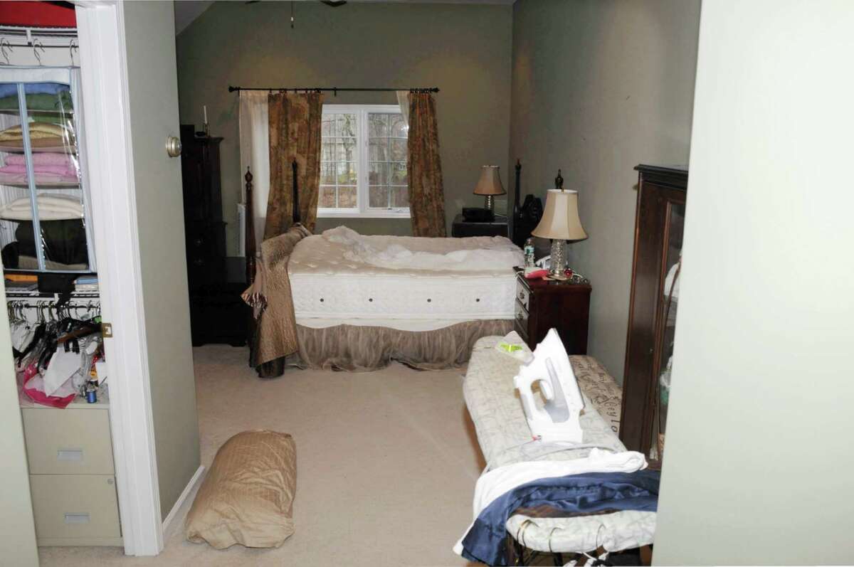 This photo released by the Connecticut State Police on Friday, Dec. 27, 2013, and contained in a document titled "Sec 4 -Scene Search Day 3," shows a room in the home where Adam Lanza lived with his mother in Newtown, Conn. Lanza gunned down 20 first-graders and six educators with a semi-automatic rifle at Sandy Hook Elementary School on Dec. 14, 2012, in Newtown, after killing his mother inside their home. Lanza committed suicide with a handgun as police arrived at the school. (AP Photo/Connecticut State Police) ORG XMIT: BX122
