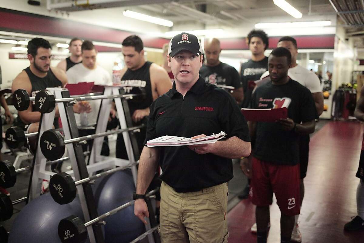 Coach Shannon Turley addresses Stanford football players at their training facility at Stanford University in Palo Alto, Calif. on Thursday, Dec. 19, 2013. Turley has been critical in keeping players healthy and helping them avoid injuries.