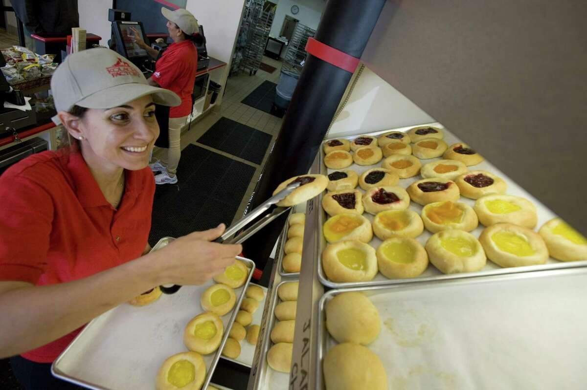 Kolache Factory franchisee Kathy Skaff stocks the shelves of her shop in Tustin, Calif. Skaff opened a Kolache Factory after securing a $250,000 loan through the SBA Community Advantage program. "I'm very lucky," she says.