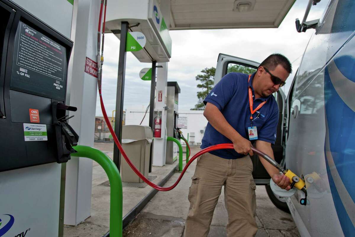 Alejander Ruiz of AT&T stops for a fill-up with compressed natural gas at a Clean Energy station on Washington.