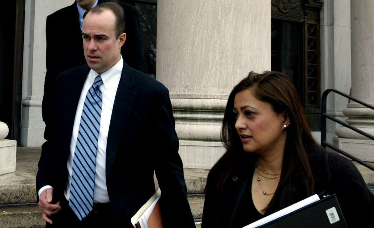 Assistant U.S. Attorneys Stephen Reynolds and Krishna Patel, who are prosecuting Douglas Perlitz, leave the Federal Courthouse in New Haven on Feb. 2, 2010. Perlitz, a Fairfield University graduate, is accused of sexually abusing Haitian boys who his charity supposedly was helping.