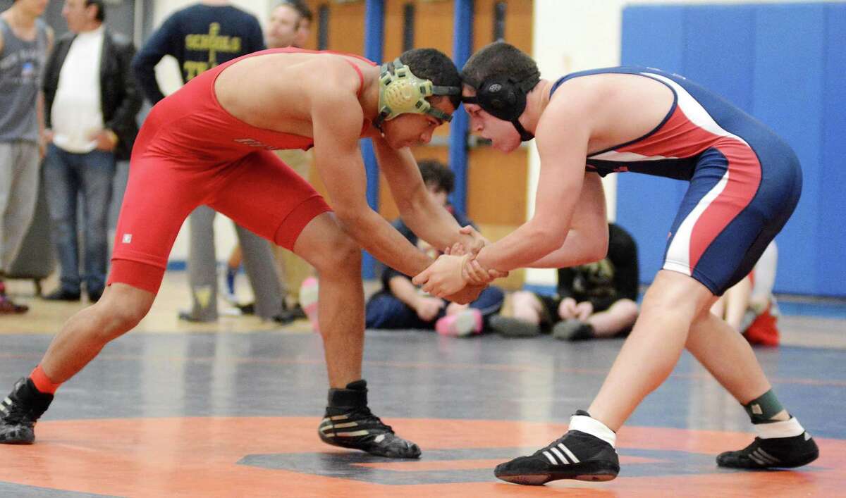 New Fairfield High Schools Andrew Vazquez, right, wrestles against Northeasterns Matthew Nieves in the 170 lb weight catagory during the Danbury Holiday Wrestling Tournament at Danbury High School on Saturday Dec. 28, 2013.
