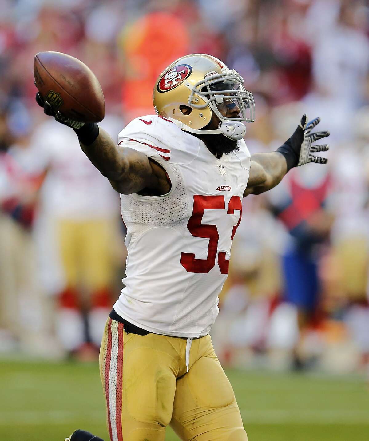 San Francisco 49ers inside linebacker NaVorro Bowman celebrates is fumble recovery against the Arizona Cardinals during the second half of an NFL football game, Sunday, Dec. 29, 2013, in Glendale, Ariz. (AP Photo/Matt York)