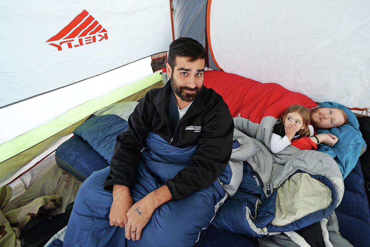 Marcus Paterno, left, and friend Jared Gilthorpe and his daughter, right, camp outside of Best Buy the day before Thanksgiving. The friends arrived to Best Buy at noon in hopes of being the first in line. Michael Rivera/@michaelrivera88
