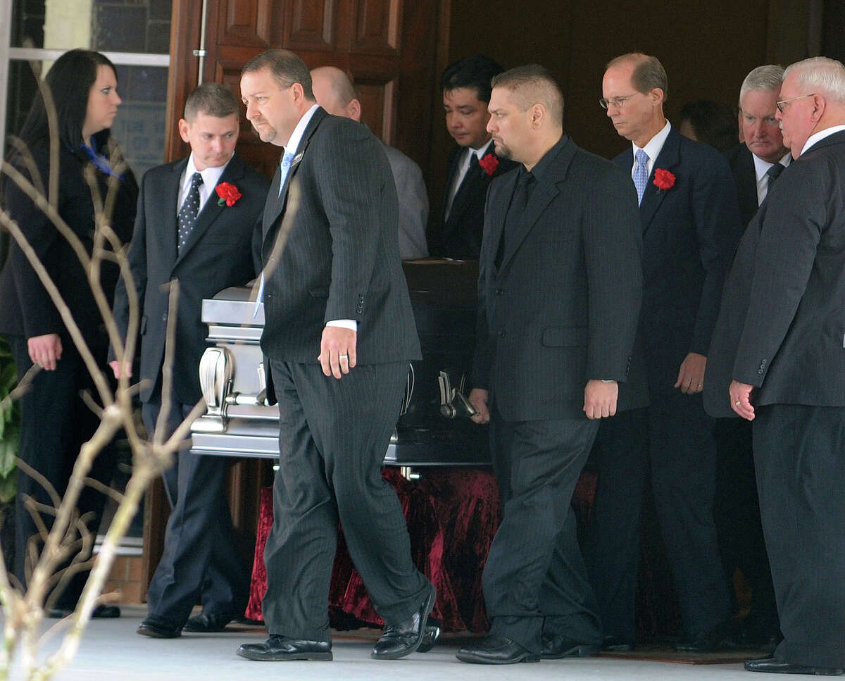 Pallbearers escort Victor Lovelady's casket from services at St. Charles Catholic Church in Nederland on Tuesday January 29. Lovelady was killed after a terrorist attack at an Algerian gas plant where he worked. Photo taken Tuesday, January 29, 2013 Guiseppe Barranco/The Enterprise