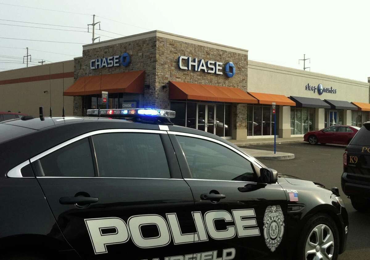 Police on scene at the Chase Bank office in Kings Crossing shopping center on Grasmere Avenue, which was robbed Thursday, Sept. 12, 2013, a short time after a Bank of America branch on Kings Highway Cutoff.