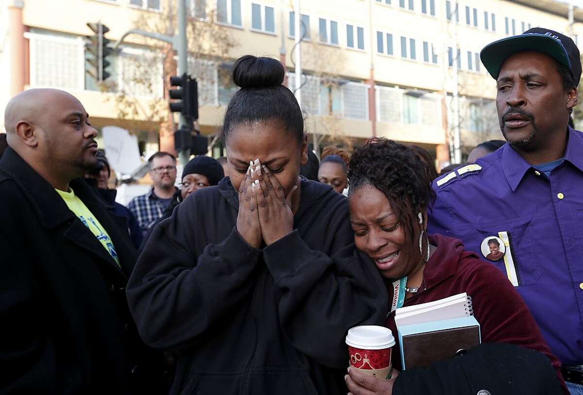 The mother of Jahi McMath, Nailah Winkfield, (left) and Dr. DeTrice Rodgers, Jahi's 5th grade teacher, embrace after they stated that the court order to remove Jahi from a ventilator has been extended to January 7th 2014. The statement was made by the family to the news media in front of Children's Hospital in Oakland, Ca. , on Monday Dec. 30, 2013. 13-year-old Jahi McMath is slated to be removed from a ventilator at 5pm this afternoon, after being declared brain-dead by the hospital.