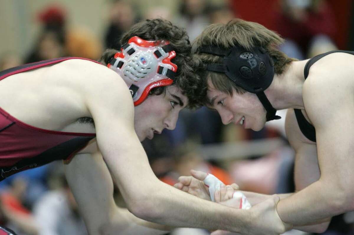 Greenwich High Schools Victor Cerio and Stamford's Dan Kowaleski go head to head during Tuesday evenings meet in Greenwich.